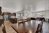 Living area.  Dining room, living room and kitchen