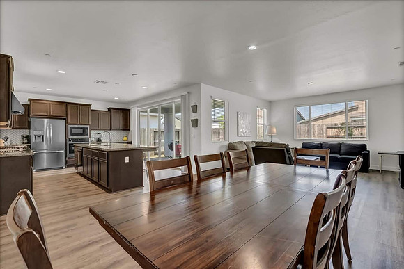 Living area.  Dining room, living room and kitchen