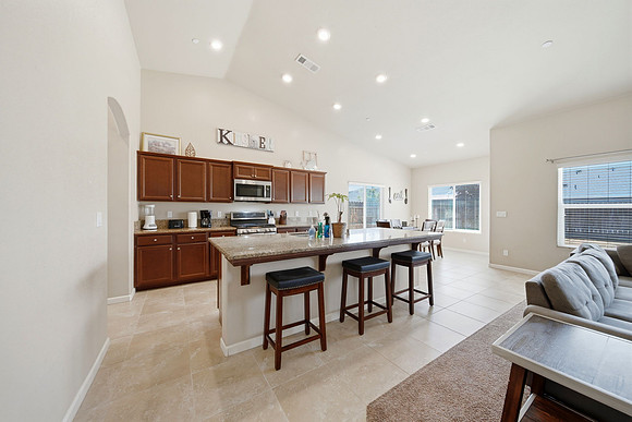 full kitchen with seating at the island for 3