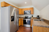 Equipped with an electric oven, microwave, and dishwasher.