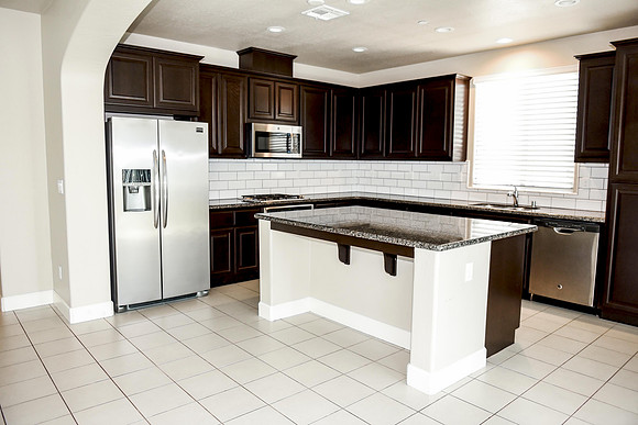 full size refrigerator, dishwasher, microwave, and a gas stove.