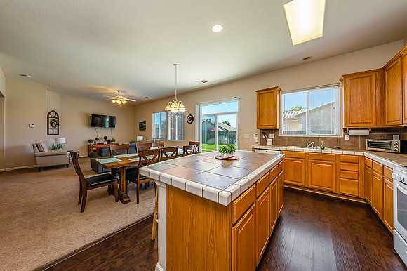 kitchen, dining area and living room.