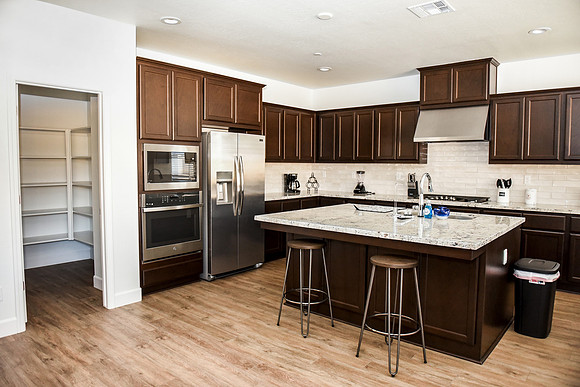 kitchen, full refrigerator, microwave and stove